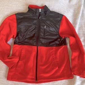 The North Face boys light weight fleece jacket age 10-12. Red and black